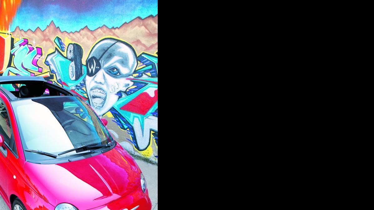 
The Fiat 500 Abarth Cabrio. Background mural is on Black Label Cycle, Ninth and Mulberry, Kansas City. Owners: Jesse Morton/Tom Lyons
