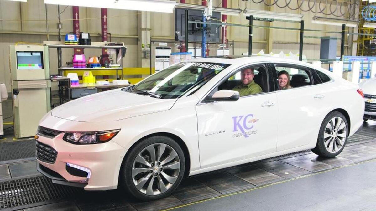 Trent Brining drove his 2016 Chevrolet Malibu off the assembly line on Tuesday at the General Motors Fairfax Assembly Plant in Kansas City, Kan. Brining’s wife, Samantha, smiled in the backseat.