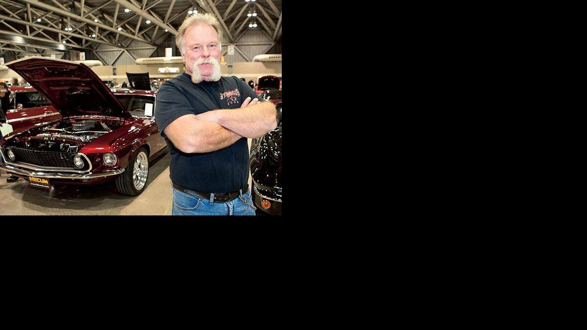 
Darick Barnhart of Raymore, Neb., and his 1969 Mustang that he restored and sold at the Mecum Auctions Dec. 4-6 in Kansas City.
