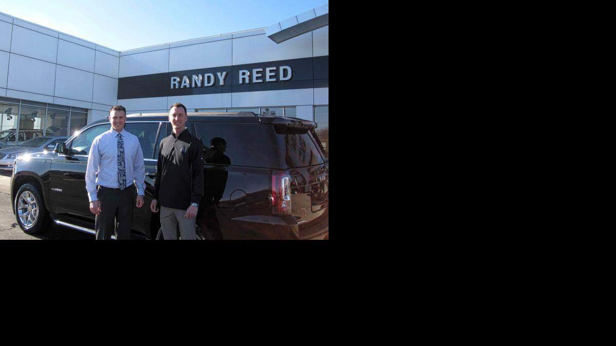 
Trevin Reed, left, is the general sales manager and David Boyer is the new vehicle manager at Randy Reed Buick GMC at 9550 NW Prairie View Road in Kansas City. They are standing in front of the Yukon they are sending to Chiefs linebacker Derrick Johnson in Texas.
