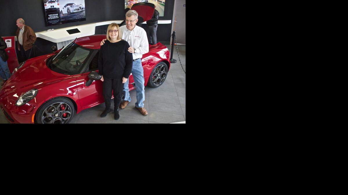 
Jolene and John Justus, and their new Alfa Romeo 4C, in the showroom at Northtowne Alfa Romeo and Fiat.
