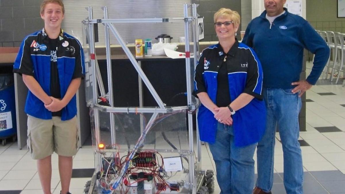 
Joey Franz, Lesli Hayter and Gary Montoya with the robot that was built for the 2014 competition.
