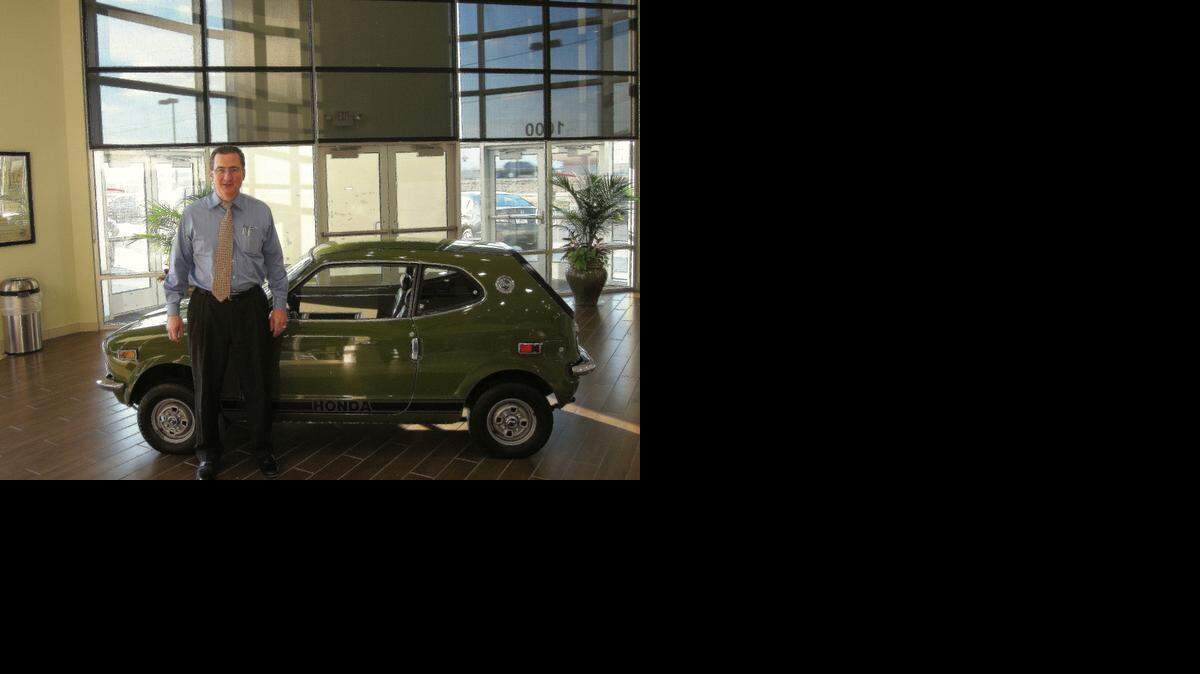 
Michael Ancona, president and part owner of Frank Ancona Honda in Olathe, stands in front of the 1971 Honda 600 Coupe, one of the early Honda automobiles. It is on display at the dealership at 1000 N. Rogers Road.
