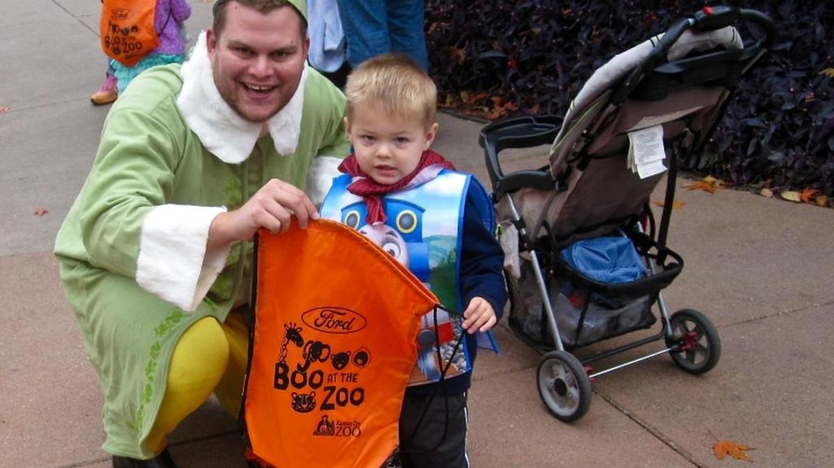 Tim Resnick, who works in the regional Ford office in Kansas City in sales and marketing, was one of many Ford employees who handed out free backpacks to children like Parker, who is from Lincoln, Neb. Ford has sponsored Boo at the Zoo for the last three years.