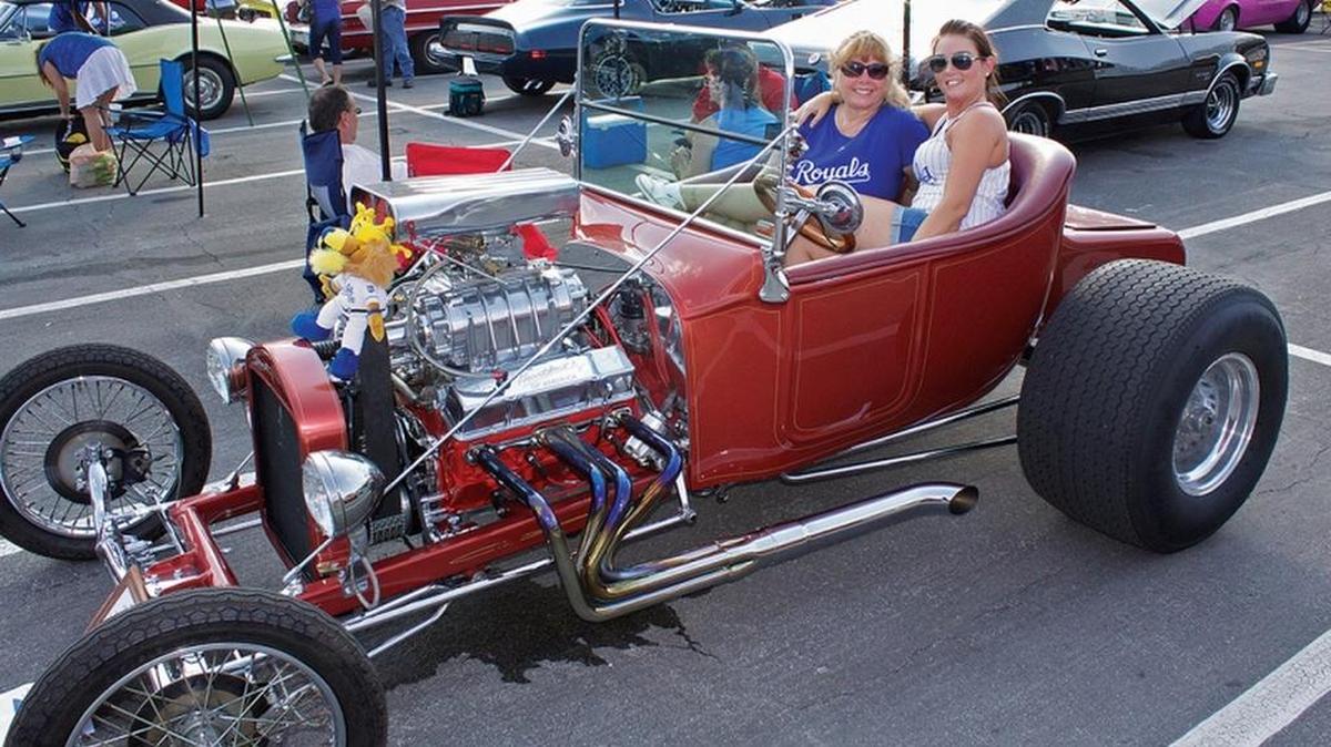 
This is a 1923 T-bucket with Chevy motor and a 671 blower owned and restored by Dave and Lori Dawson of Lee's Summit. Lori and her daughter-in-law Ryndi Dawson are pictured in the photo.

