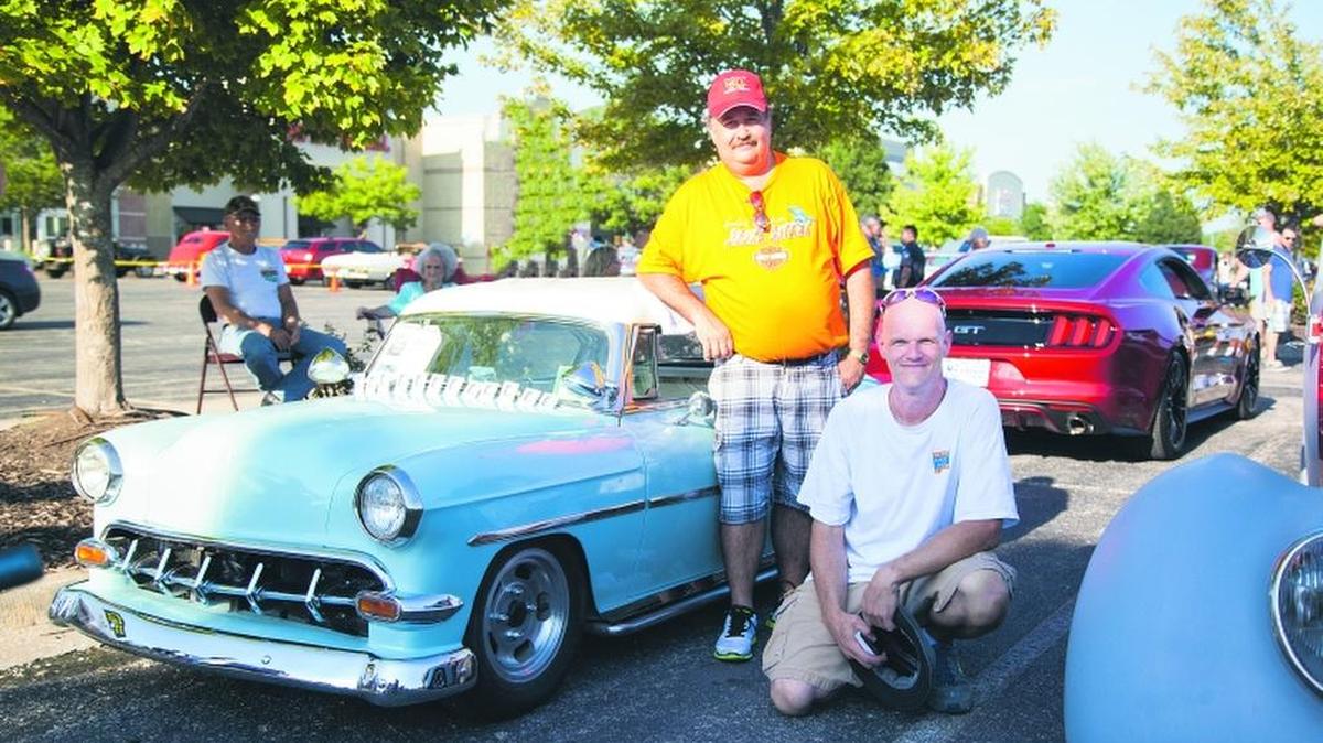 
Jim Tormena and Denver Brison. Tormena is the organizer of Jim T’s Cruise Nights at The Pavilion at Hartman’s Heritage Center in Independence. Brison helps Tormena with organizing the cruise each week. They are shown next to the 1954 Chevy Bel Air Hard Top dwarf car belonging to Gene Tweedy of Pleasant Hill, Mo.
