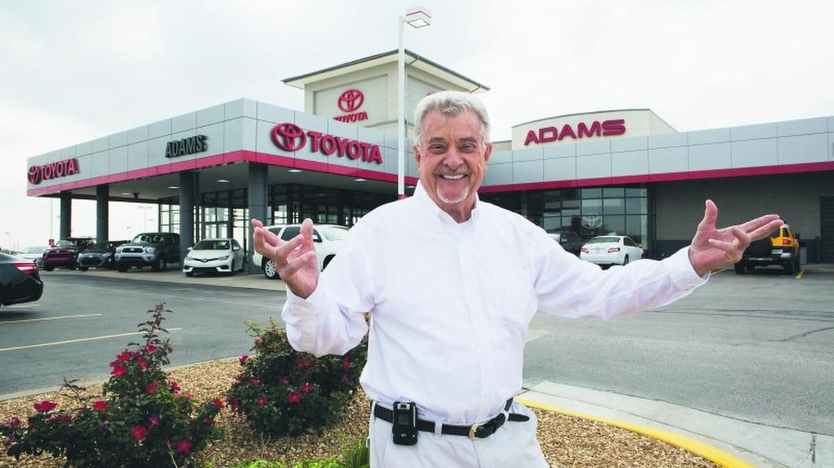 Ray Adams is proud of his Adams Toyota dealership and all that he has to offer to his customers. He is also comfortable posing for the camera, something he has been doing in his commercials for decades.