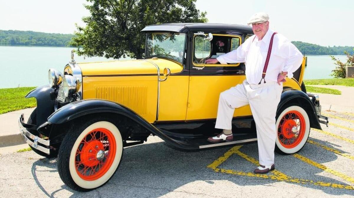 
George Deel poses with his Late 1931 Model A Ford Coupe 
