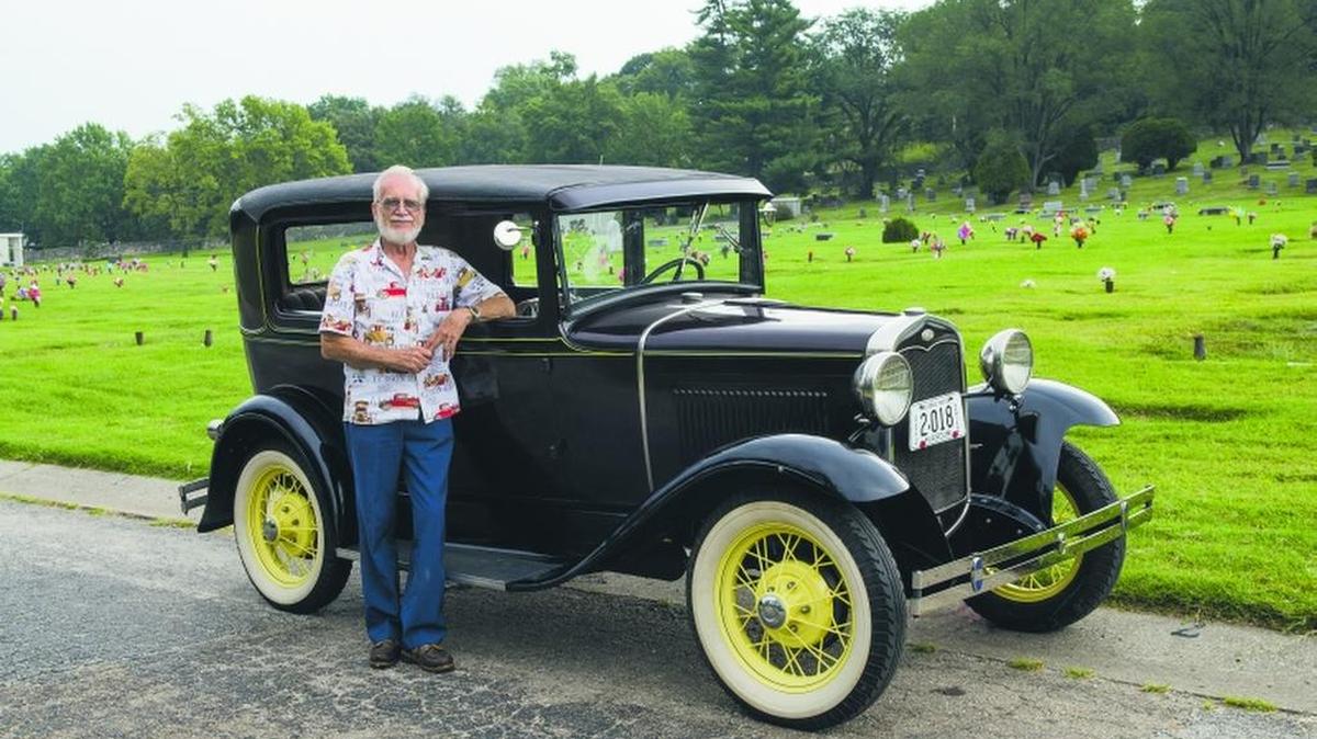 
David Renshaw and his 1931 Ford Model A. When his wife died in December 2014, she was buried at Mount Washington Cemetery, which is in the background. After she died, his family pitched in and helped him restore the Model A.
