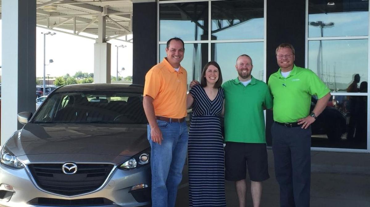 
More than 700 people signed up to win a 2016 Mazda3 as part of the grand opening of Premier Mazda in Kansas City. Zach and Rachel Sewell were the lucky winners of the free Mazda3, drawn on July 31. From left to right are Thomas Bies, owner of Premier Mazda; Rachel Sewell, Zach Sewell, and Tim Smith, the general manager of Premier Mazda.

