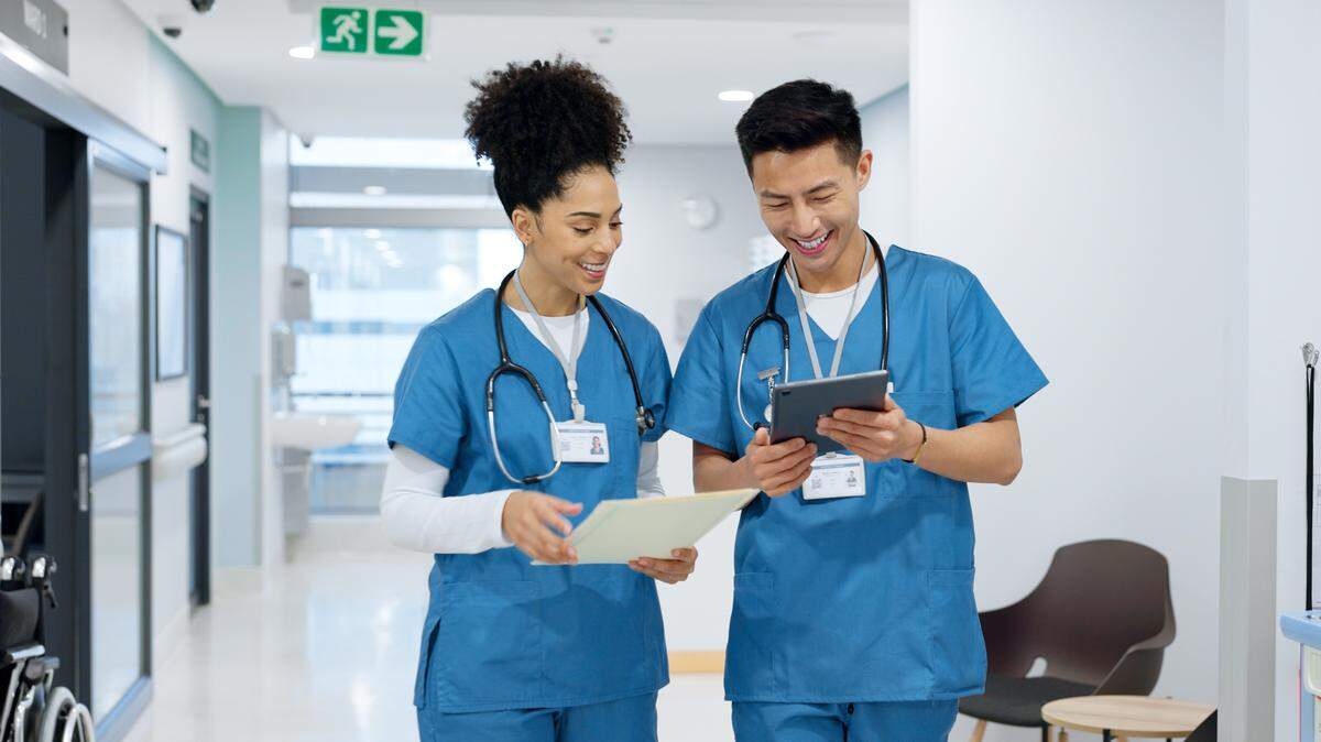 Hospital, nurse and people with tablet in discussion with analysis of results and health report in clinic.
