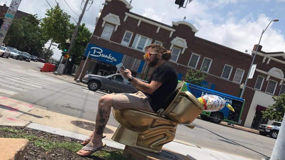 Zack Mufasa took a break on the golden toilet installation in Westport.