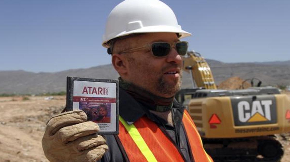 
Director Zak Penn shows a box of a decades-old Atari "E.T. the Extra-Terrestrial" game found in a dumpsite in Alamogordo, N.M. 
