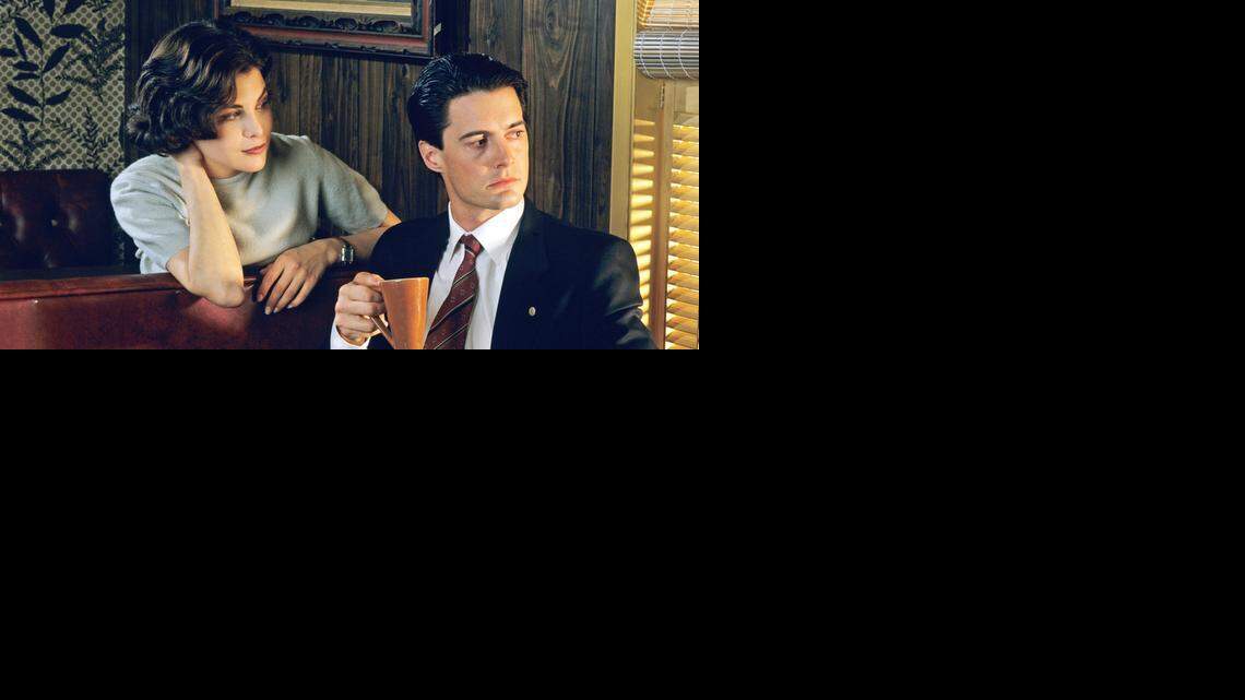 
Audrey Horne (Sherilyn Fenn) and coffee-obsessed FBI Agent Dale Cooper.


