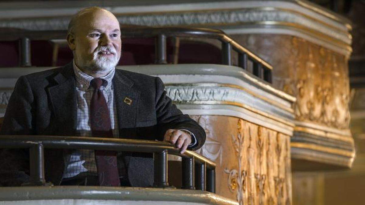 
“If you can get people interested in revitalizing downtown and supporting the arts and maintaining this historic building they naturally want to support you,” says Brian Williams, the new development director of the Folly Theater downtown. Here he is in one of the theater’s boxes.
