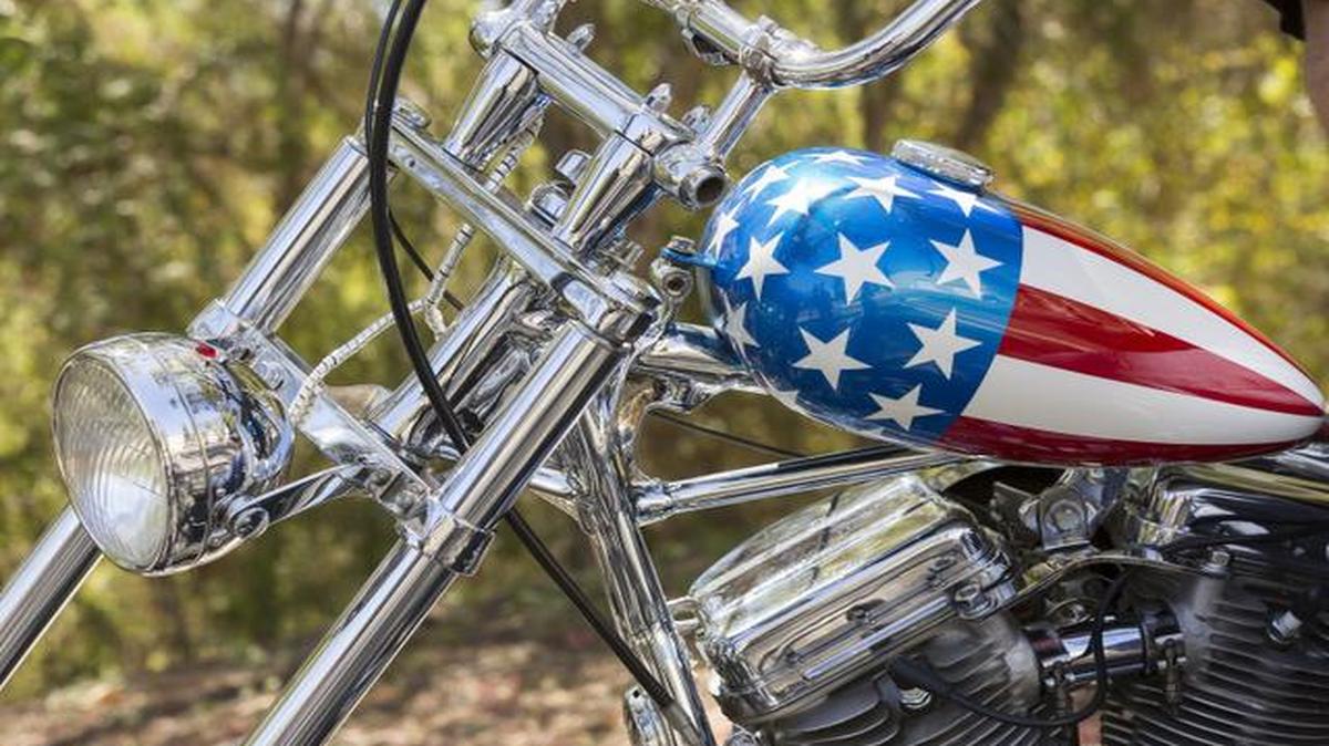 
This Sept. 4, 2014, photo shows a detail of the Captain America chopper Peter Fonda rode in “Easy Rider” at the Profiles in History auction house in Calabasas, Calif. 
