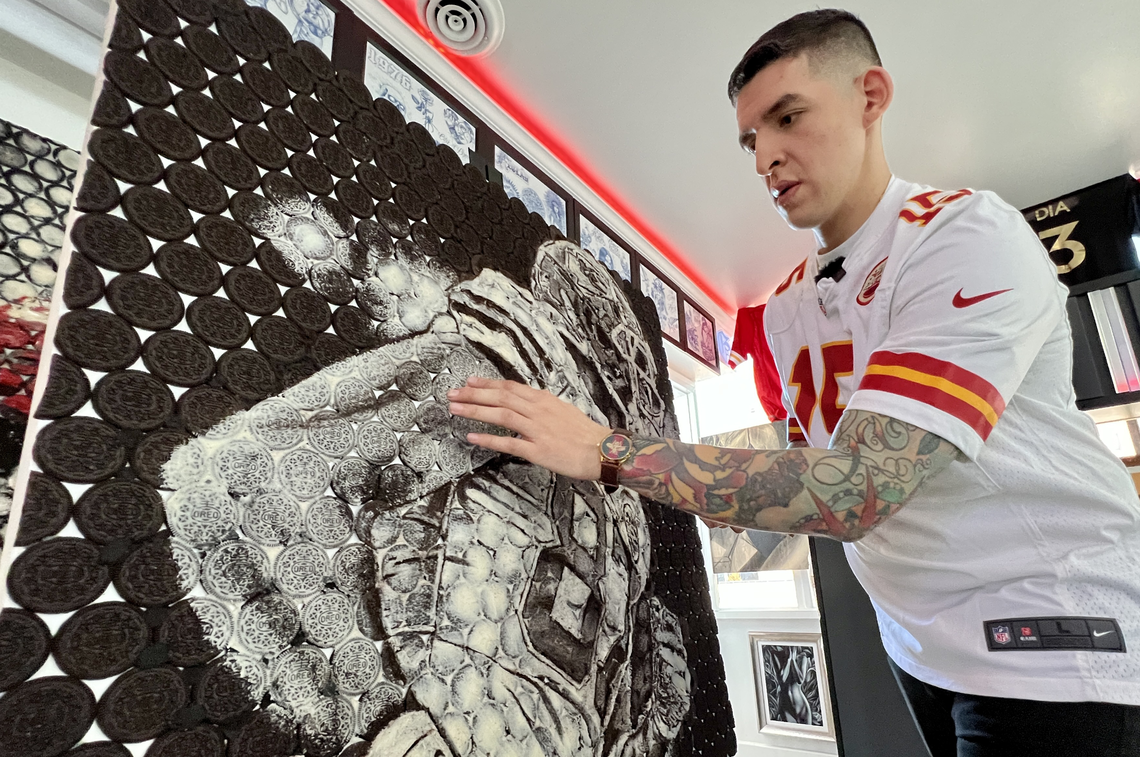 Kansas City artist Gabe Uvario smooths out highlights on a portrait he is finishing of Kansas City Chiefs tight end Travis Kelce in his studio on Broadway Boulevard. Uvario and his girlfriend, fellow artist Reeka Garcia, have made Oreo portraits of players to honor the team’s championship season.