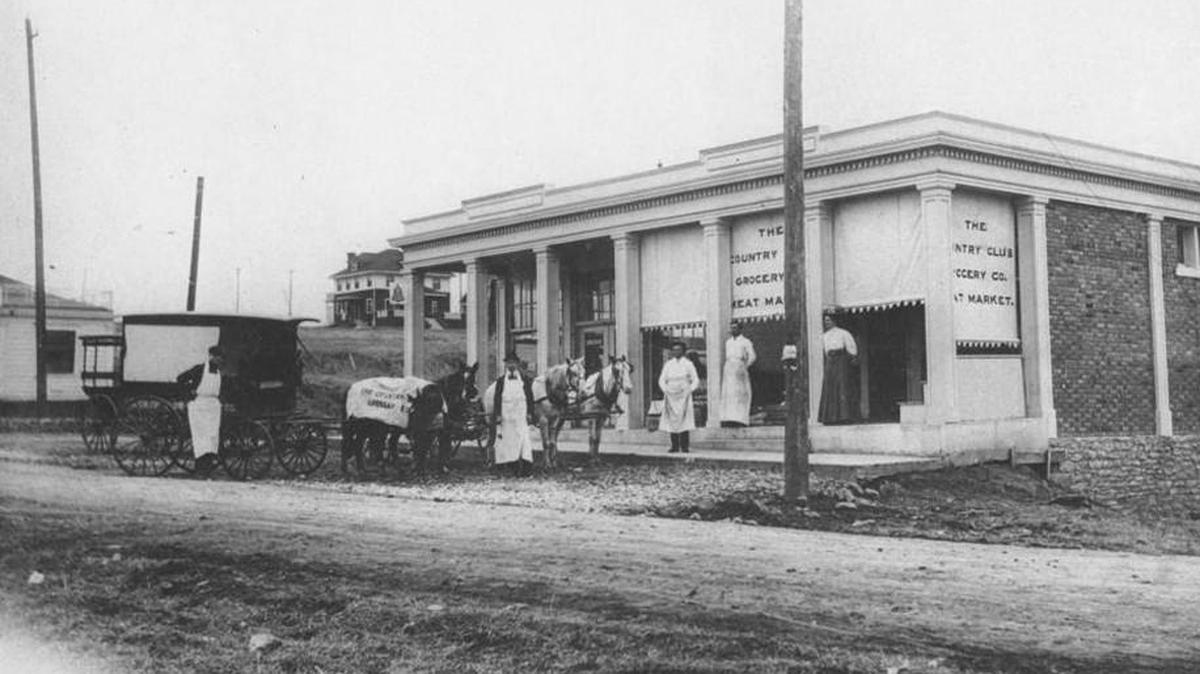The first shops built by J.C. Nichols to serve his residential developments are still there (expanded at one point and now missing their columns) on 51st Street between Brookside Boulevard and Oak Street. The building in the background may be the first house Nichols built in Kansas City.