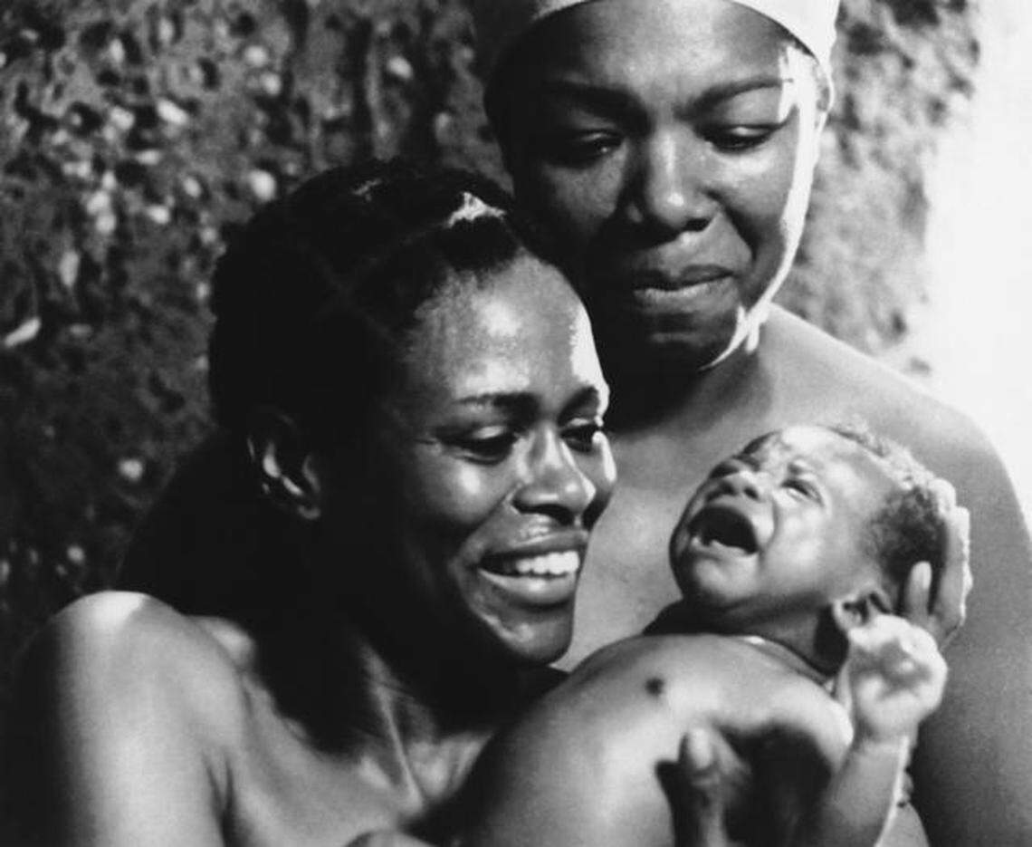 This is a scene from ABC’s 1977 miniseries “Roots” with actress Cicely Tyson with baby; and Maya Angelou in background. Angelou received an Emmy nomination for her role as Nyo Bobo in Alex Haley’s television miniseries. (AP Photo/ABC)