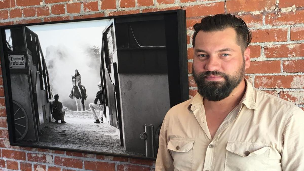 Kansas native and Louisiana State University photography assistant professor Jeremiah Ariaz’s exhibition “Staging the West” at the Volland Store in Alma, Kan., explores cultural appropriation through images of Buffalo Bill-like re-creations of the American West for contemporary audiences in Germany.
