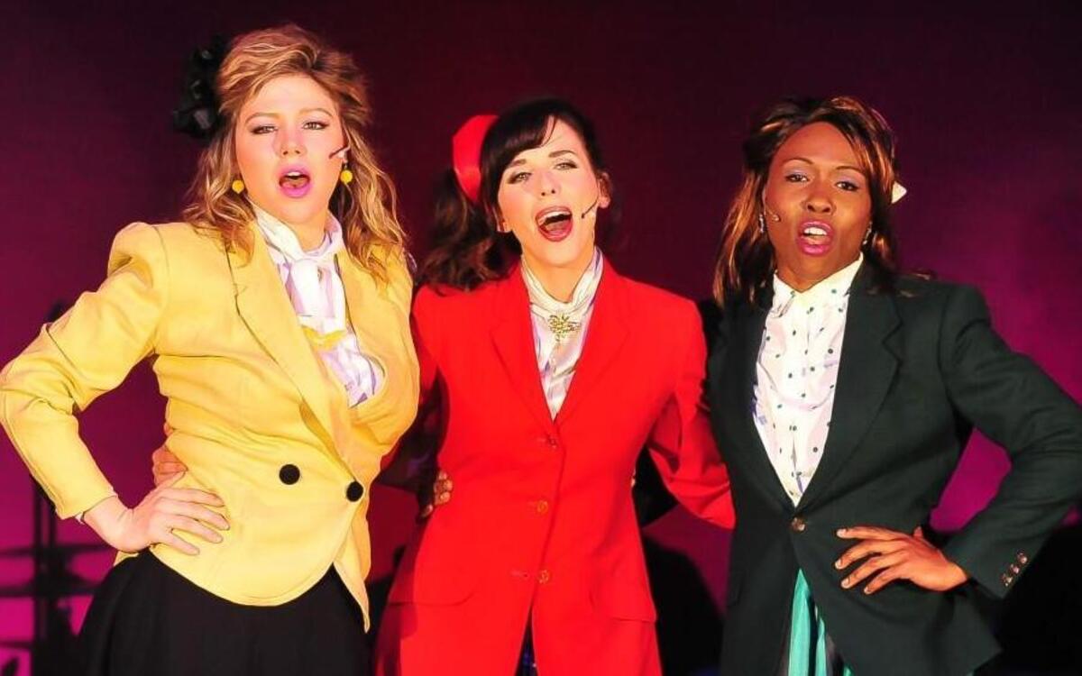 Colleen Grate (from left), Molly Denninghoff and Chioma Anyanwu are the Heathers, the popular girls who rule the school, in “Heathers: The Musical” at the Unicorn Theatre.