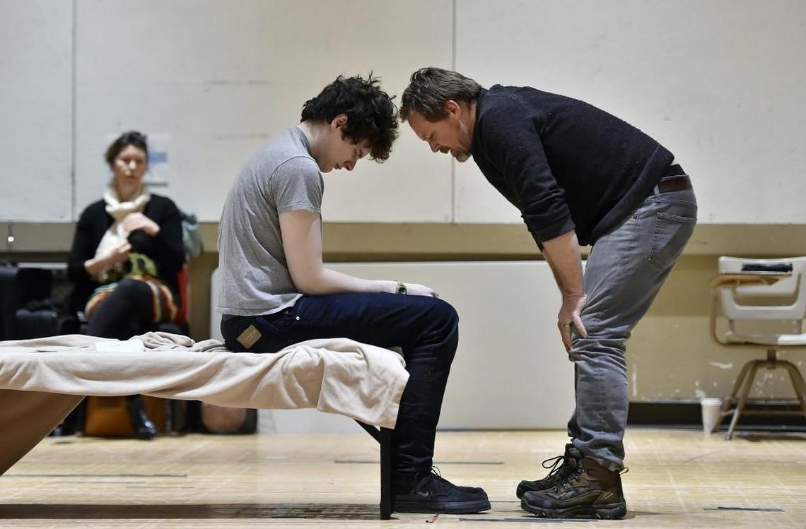 Jamie Sanders, who is making his professional stage debut in the Kansas City Repertory Theatre’s production of “The Curious Incident of the Dog in the Night-Time,” has Tourette’s syndrome. Sanders (center), who portrays Christopher, a character with autism, rehearses a scene with Jason Chanos who plays Ed. Stephanie Roberts (left), who plays Judy, watches.
