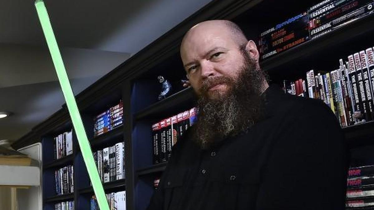 Jason Aaron of Prairie Village is the writer of the “Scalped” comic book, which is being adapted for TV by WGN America. Aaron also writes Marvel Comics’ “Star Wars” series, which has been the top-selling comic-book title nationwide for several months running. His story takes up after the Death Star was destroyed in the very first Star Wars movie, before the events of "The Empire Strikes Back." Aaron holds his collectible light saber near a stand of comic books that he is the writer for.