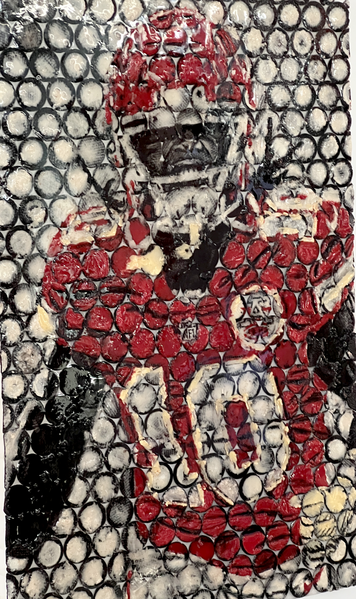 Artist Gabe Uvario used Christmas red Oreos, as well as the regular black-and-white version, to make this portrait of Chiefs running back Isiah Pacheco. It’s the only one of the Oreo artworks with color.