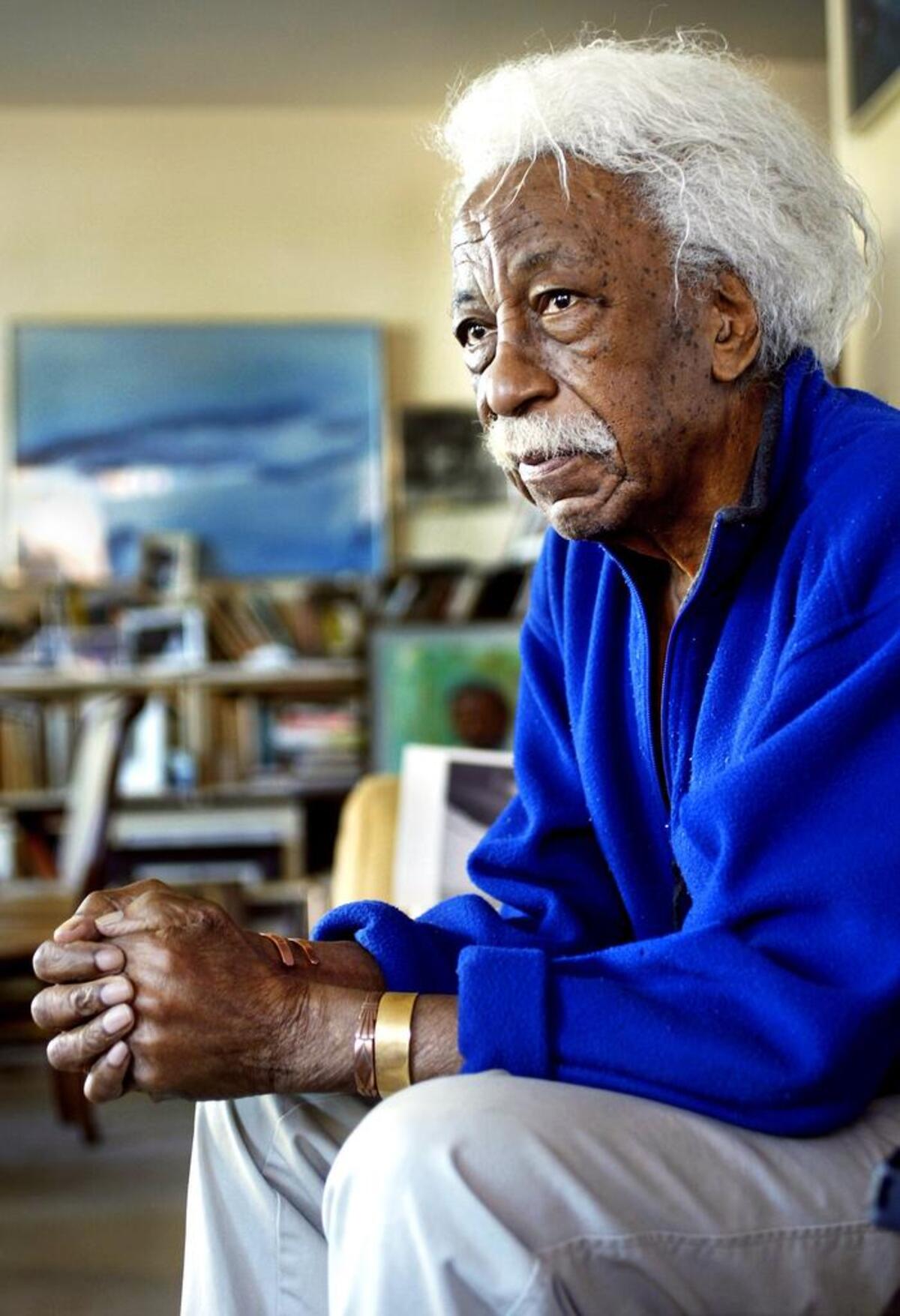 Gordon Parks, renowned for his photography, painting, composing, filmmaking and writing, is shown in his Midtown Manhattan apartment in 2004. He died two years later at age 93.