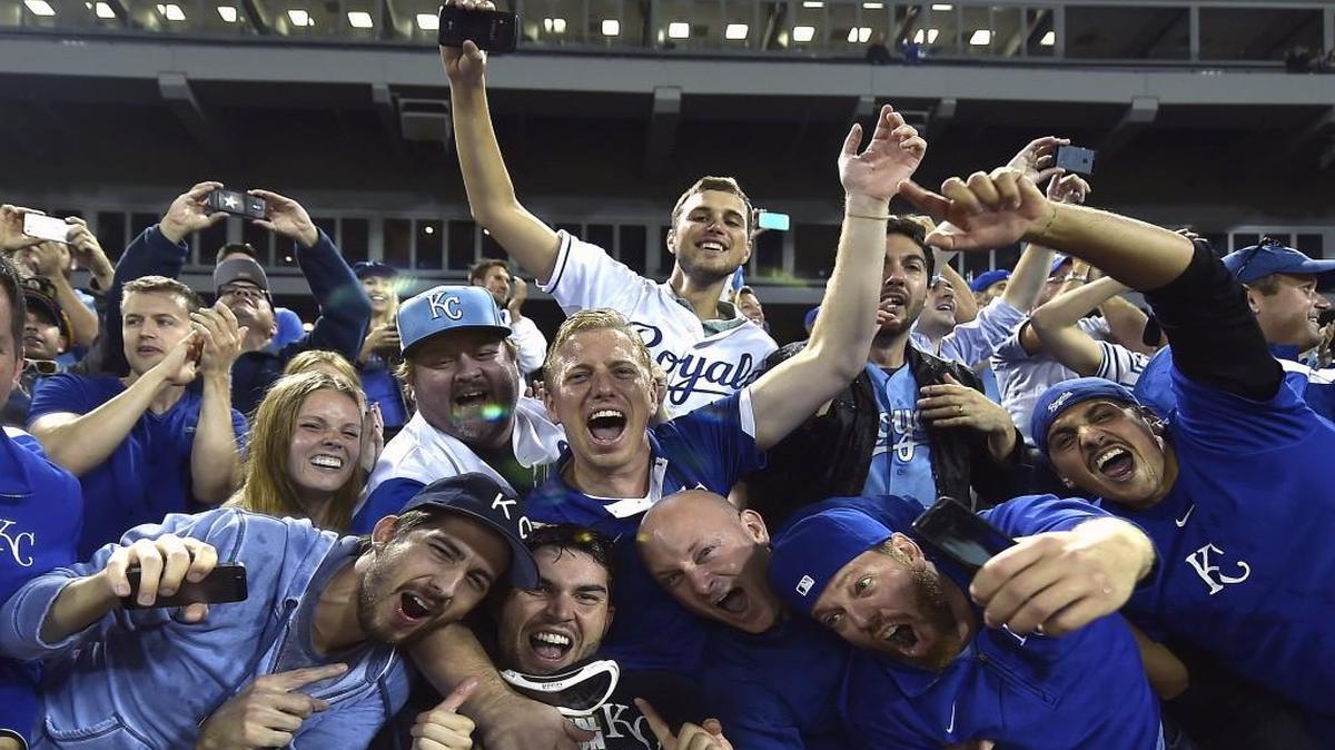 Kansas City Royals’ Eric Hosmer poses with the fans as they celebrate a wildcard spot in the playoffs on Sept. 26, 2014, at U.S. Cellular Field in Chicago, Ill.