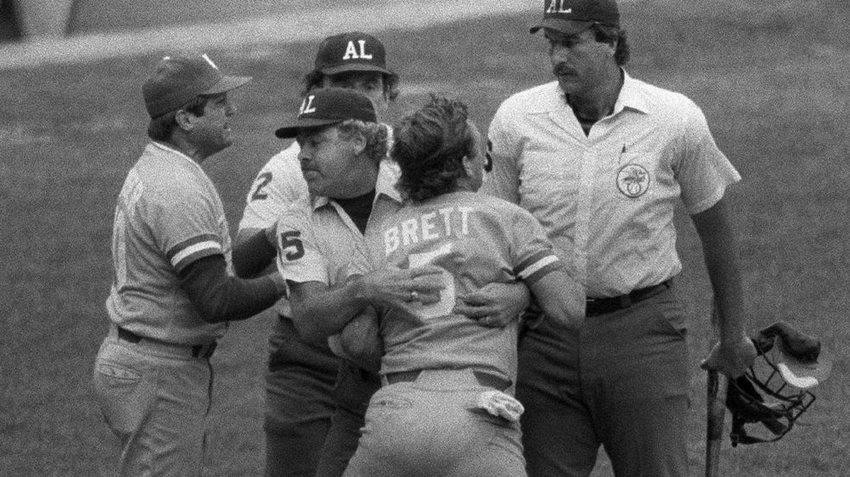 George Brett was livid after being called out during the famous Pine Tar Game in 1983. Here, Brett is restrained by umpire Joe Brinkman after Brett’s bat, held by umpire Tim McClelland, was ruled illegal during the ninth inning of the Royals’ July 24, 1983, game at Yankee Stadium.