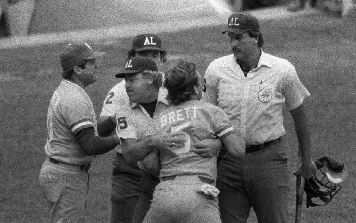 
The Royals’ George Brett was livid after being called out during the famous pine-tar game in 1983. Brett was restrained by umpire Joe Brinkman after Brett’s bat, held by umpire Tim McClelland, was ruled illegal because of pine tar during the ninth inning of a July 24, 1983, game at Yankee Stadium. Brett had just hit a two-run home run to give the Royals the lead. Royals manager Dick Howser (left) argued on his team’s behalf. A new book by Filip Bondy, “The Pine Tar Game: The Kansas City Royals, the New York Yankees and Baseball’s Most Absurd and Entertaining Controversy,” delves into the fabled game.
