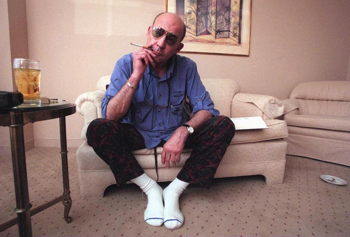 Hunter S. Thompson in 1997, just after waking up mid-afternoon in his San Francisco hotel room after a night on the town, with his ever-present scotch and cigarettes. He died in 2005.