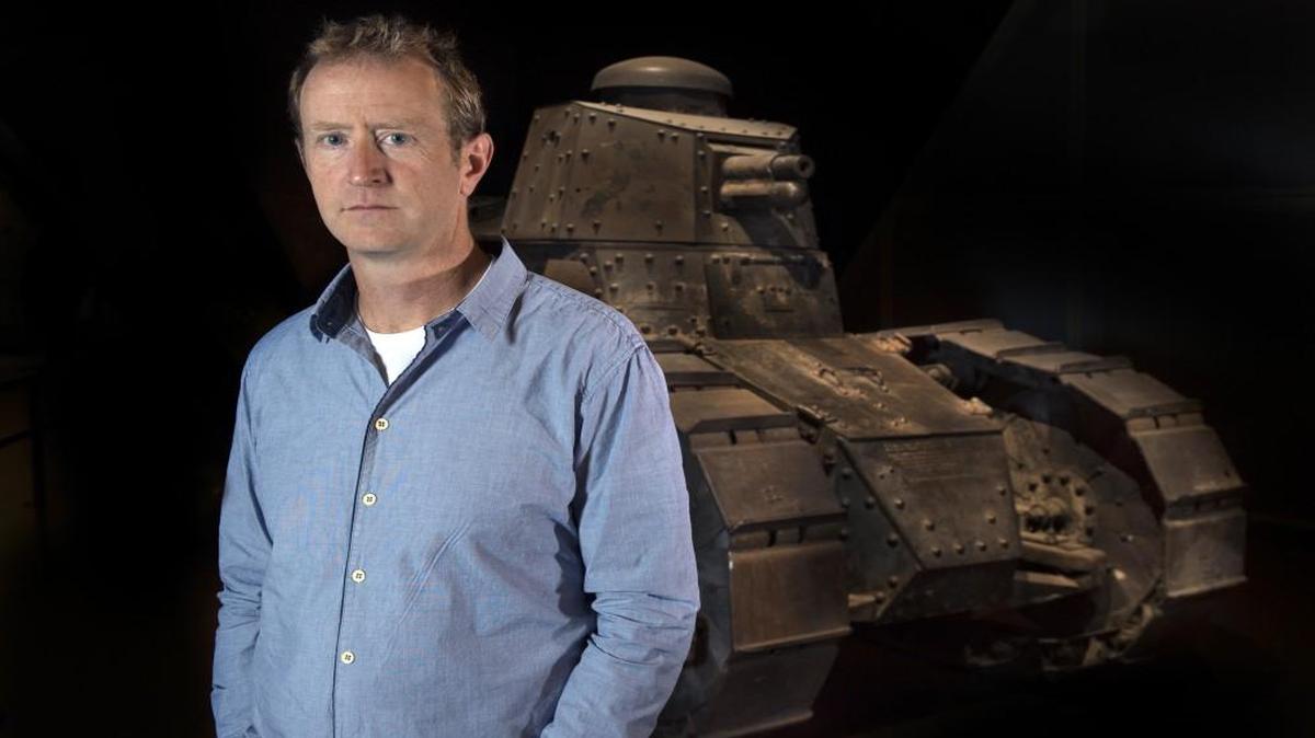 Kansas City author Whitney Terrell poses in front of the National World War I Museum’s 1917 French Renault FT-17 tank. His grandfather, Frank Terrell Sr., fought in World War I and earned a Silver Star for bravery. Whitney Terrell’s latest novel, “The Good Lieutenant,” is set in the Iraq war; he did much of his research during two embeds with troops there.