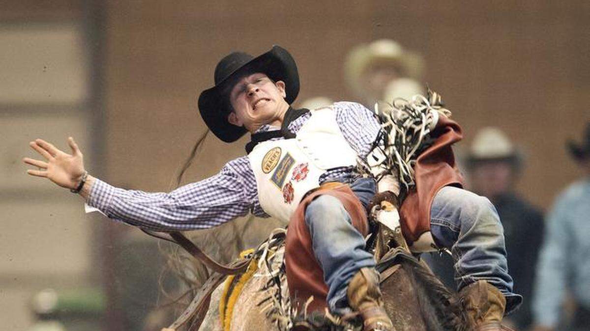 A rider in the Bareback Riding competition in the American Royal Pro Rodeo.