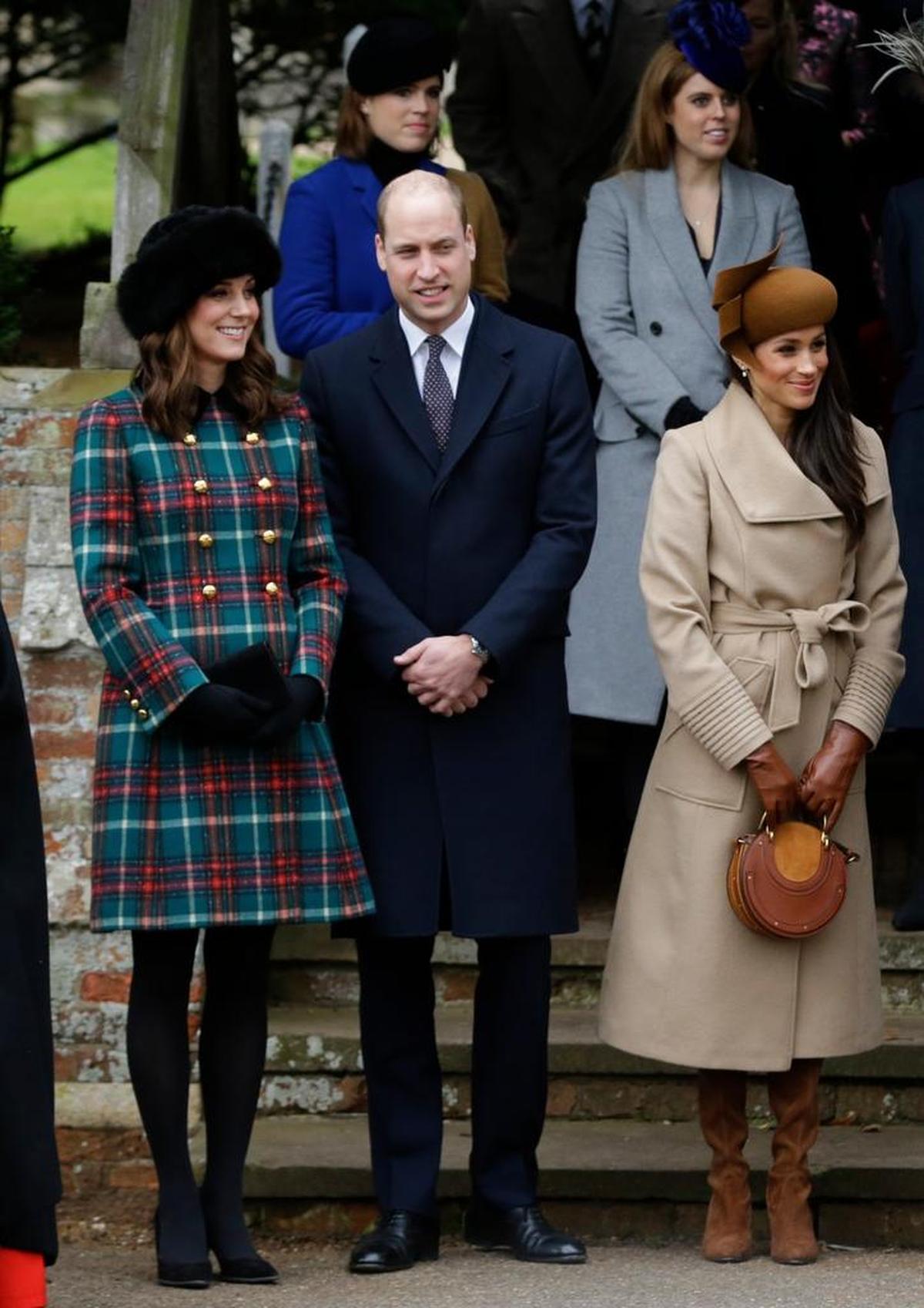 Britain's Kate, Duchess of Cambridge, left, with Prince William and Meghan Markle, right, the fiancee of Prince Harry.