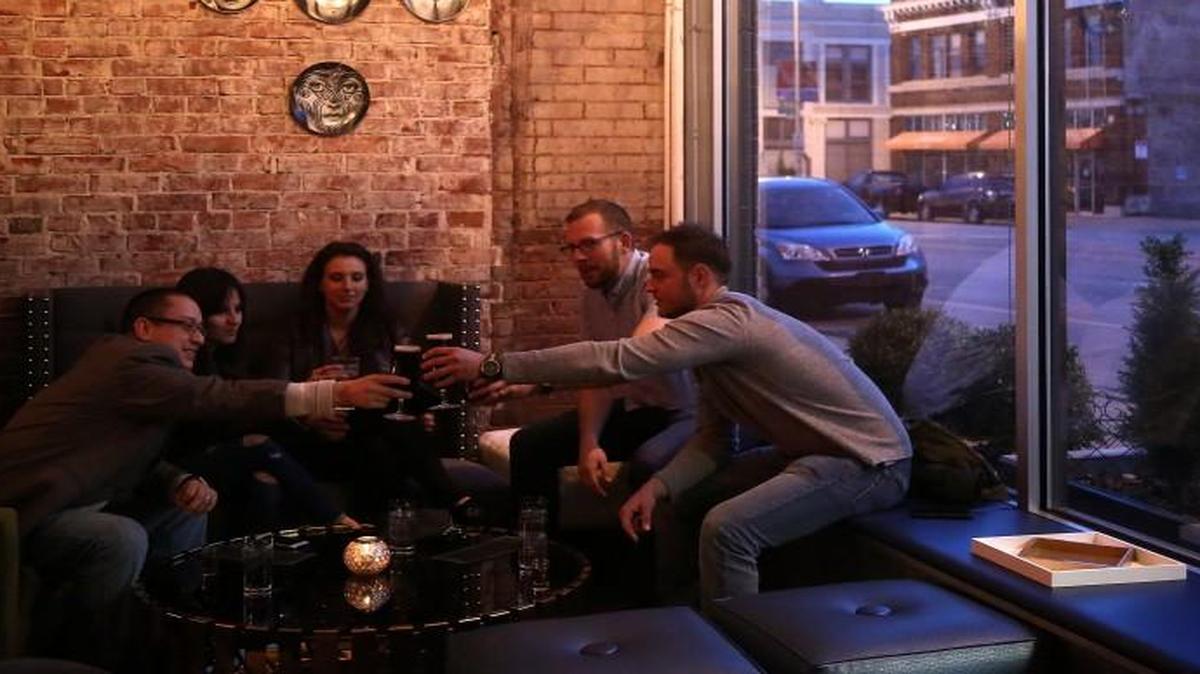 The new SoT bar on Grand Boulevard in downtown Kansas City is the scene for a toast from Eric Piza of New Jersey (from left), Rocio Paez and Kristen Sobba, both of Little Rock, Ark., Kevin Wolff of New York and Jonathan Intravia of Indianapolis.