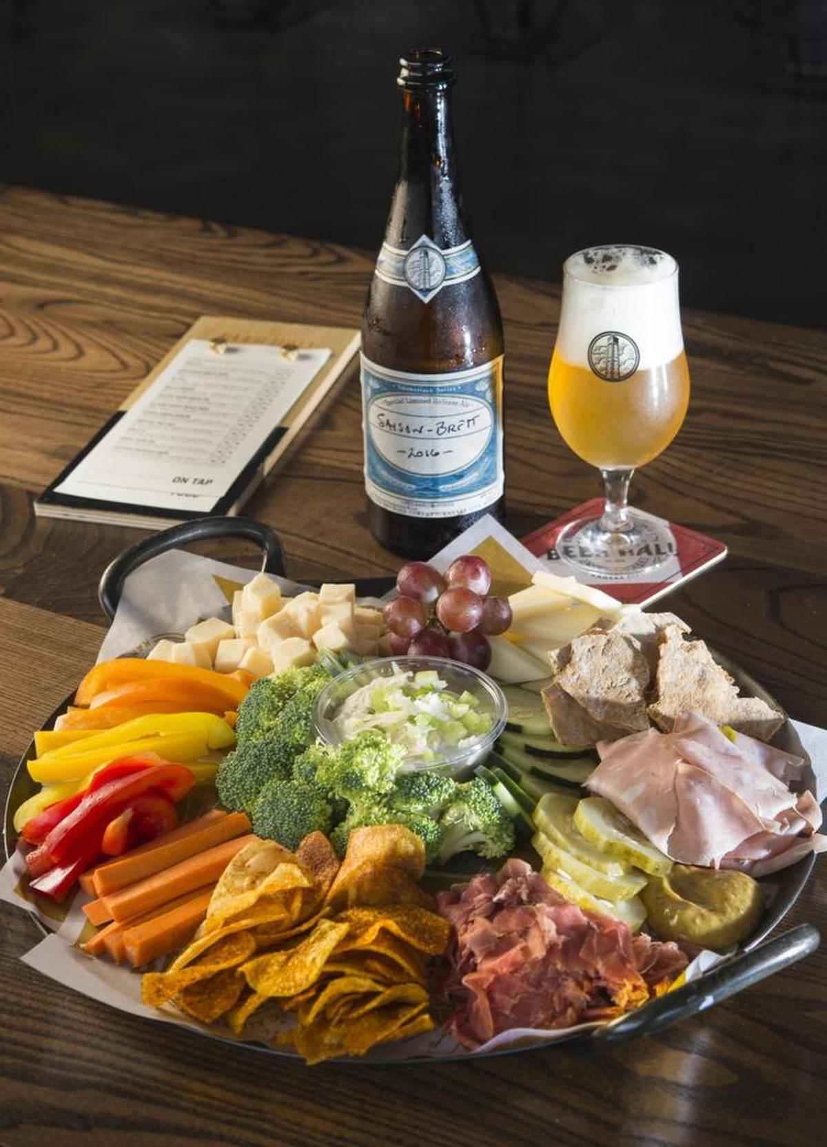 The Big Board platter with a bottle of Saison-Brett at Boulevard Beer Hall.