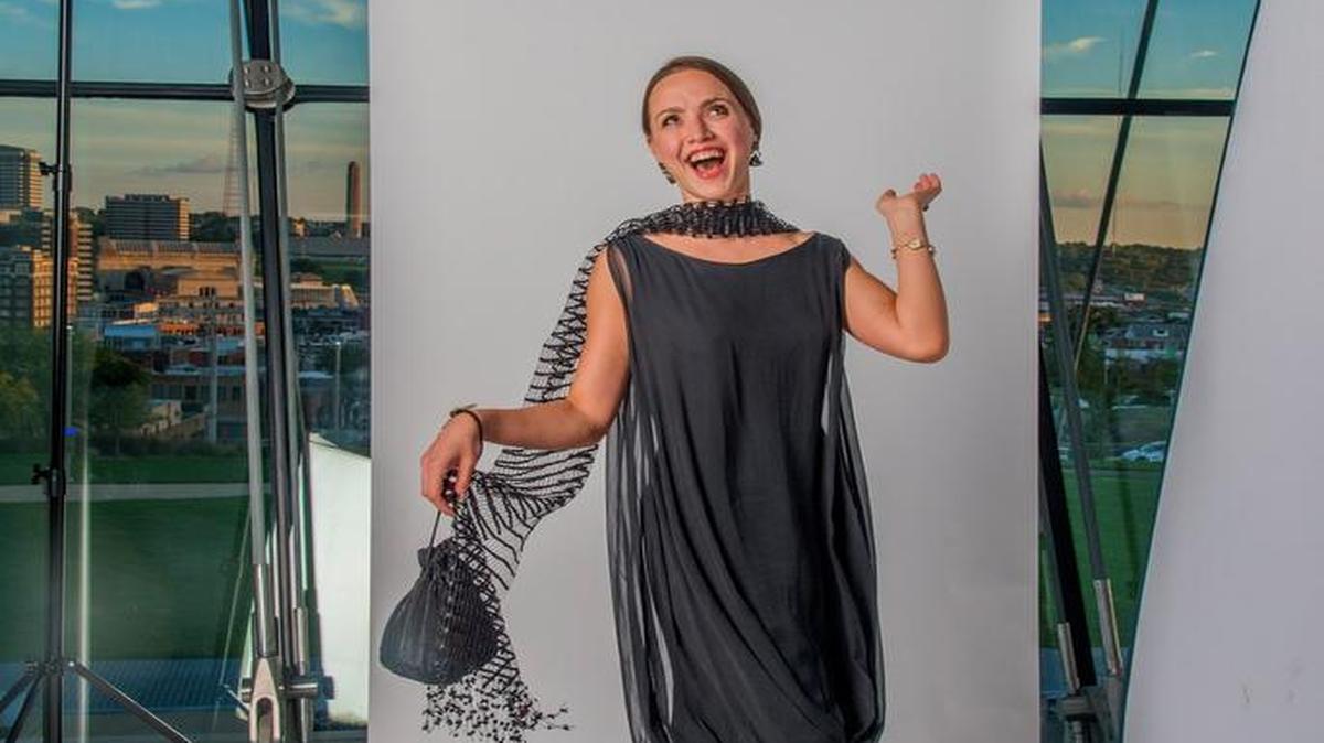 Kelsey Hellebuyck of Kansas City bought her dress at an antique mall in the River Market. “It had no hanger appeal,” she said. “But I knew that on, it could be something. And it was really cool because it didn’t have a tag, so I know it’s very old.” Her style is all over the map, based on what she feels like wearing that day — “eclectic but with a classic twist.”