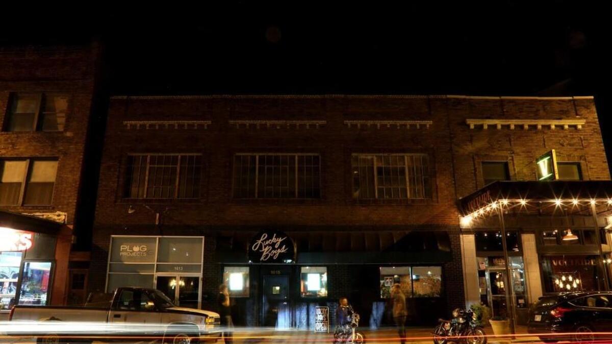 The nighttime view of Lucky Boys stand on Genessee Street.