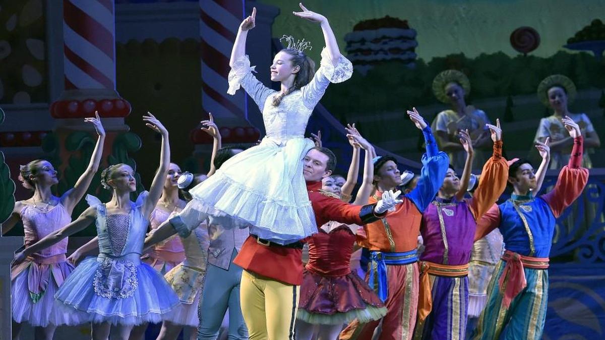 The Nutcracker Prince (Charles Martin) carries Clara (Sarah Waller) in the Land of the Sweets in Act 2 of the Kansas City Ballet’s production of “The Nutcracker.”