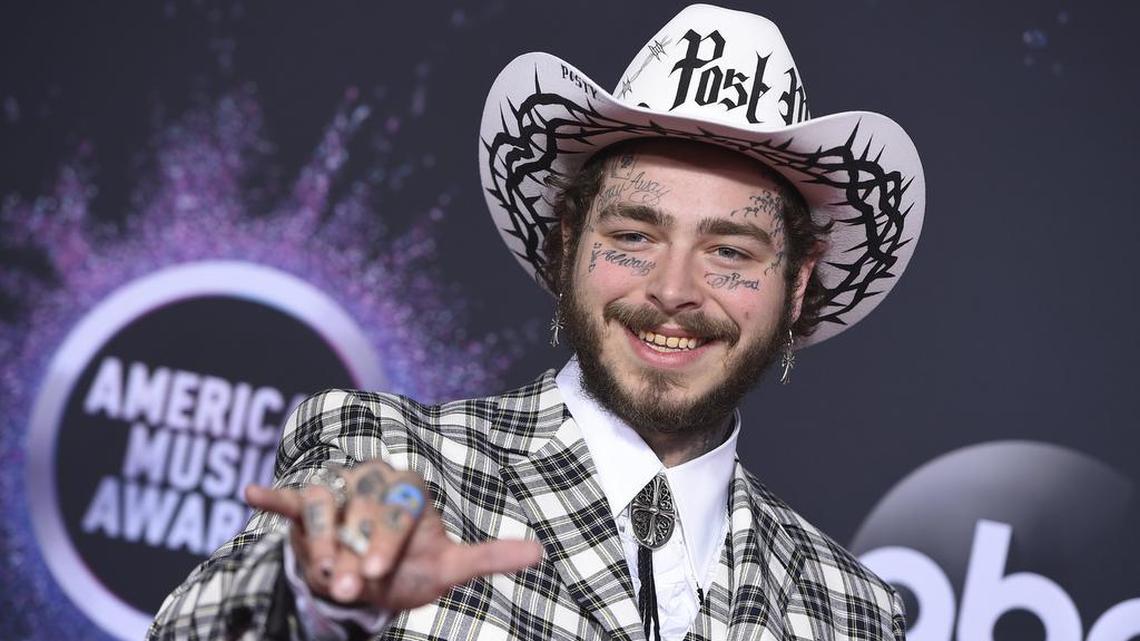 In this Nov. 24, 2019, file photo Post Malone arrives at the American Music Awards at the Microsoft Theater in Los Angeles.