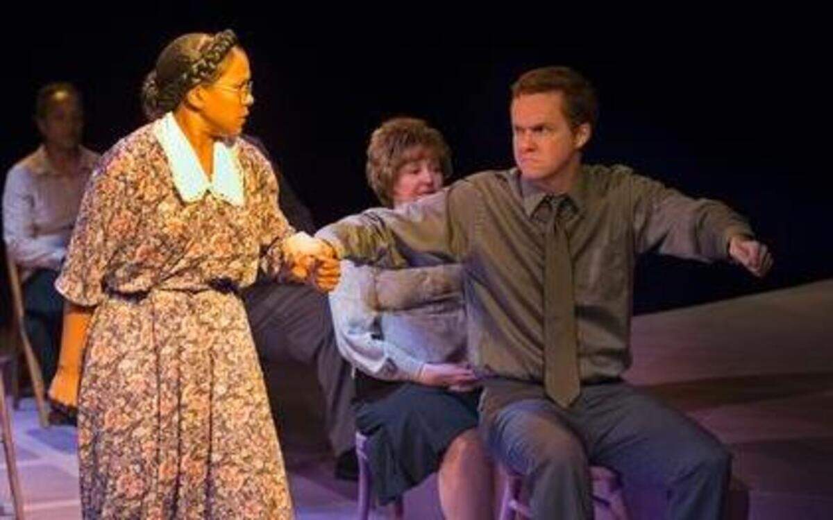 
Antonia Washington as Rosa Parks confronts Michael Ott, who portrays a bus driver, in the Coterie theater’s production of “Rosa Parks and the Montgomery Bus Boycott.”
