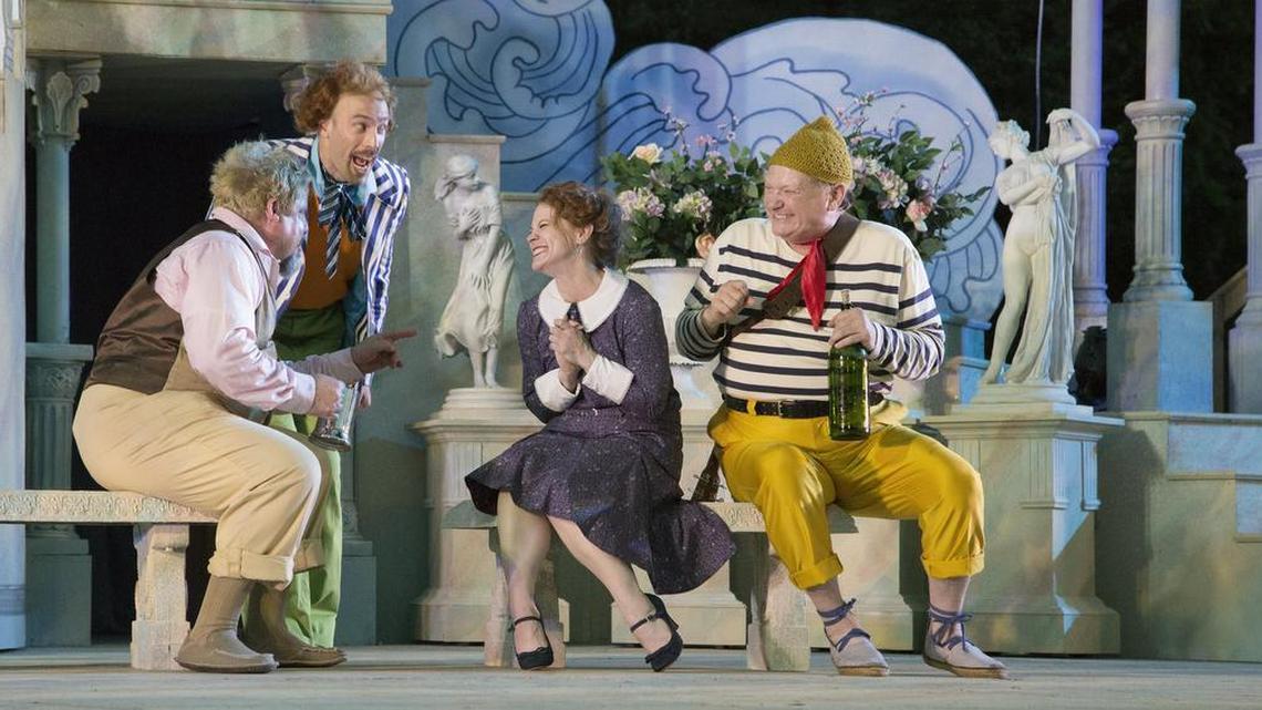 Maria (Cinnamon Schultz) talks with Sir Toby Belch (Scott Cordes, left), Sir Andrew Aguecheek (Jacques Roy) and Feste (Phil Fiorini) in the Heart of America Shakespeare Festival’s production of “Twelfth Night.” The play runs through July 3 at Southmoreland Park.