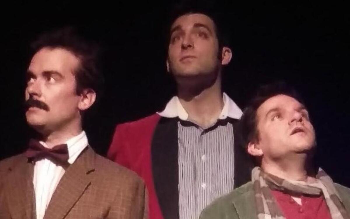 Albert Einstein (Jake Walker, left), a visitor from the future (Christopher Preyer) and Pablo Picasso (Andy Penn) contemplate what lies ahead in Steve Martin’s “Picasso at the Lapin Agile,” which runs through Sept. 24 at the Metropolitan Ensemble Theatre, 3614 Main St.