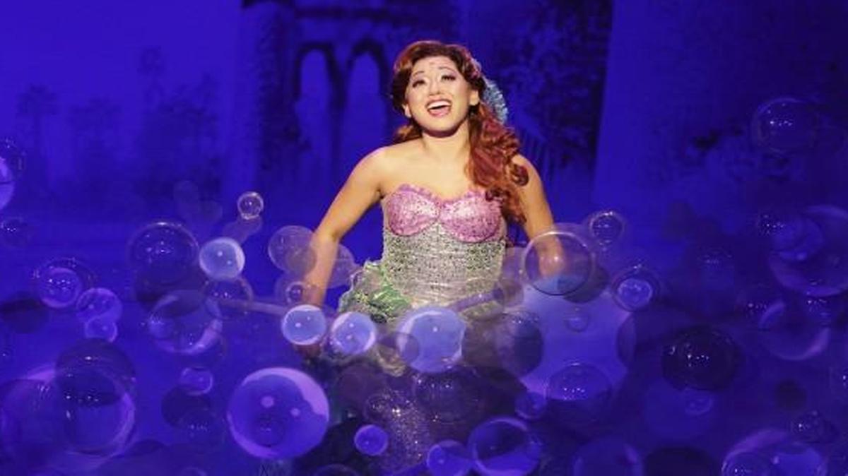 Ariel the mermaid (Diana Huey) wants to be “up where they walk, up where they run, up where they stay all day in the sun.”