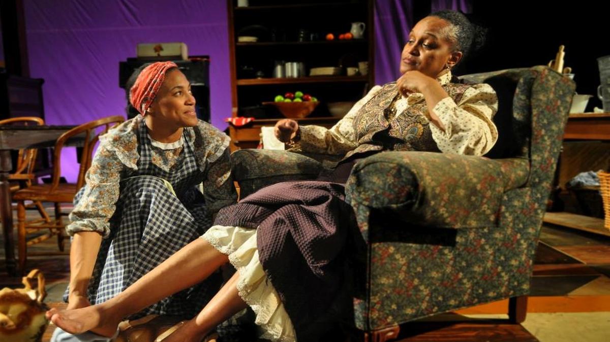 Black Mary (Shawna Peña-Downing, left) is the loyal assistant to Aunt Ester (Sherri Roulette-Mosley), a 287-year-old former slave who helps people on their journeys of healing. They’re seen in the Metropolitan Ensemble Theatre’s presentation of “Gem of the Ocean.”