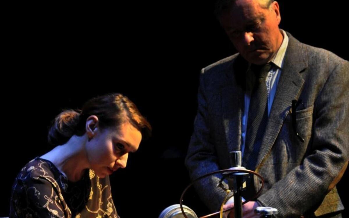 Scientist Rosalind Franklin (Amy Attaway) meets with sexism and derision from her co-worker (Robert Gibby Brand).