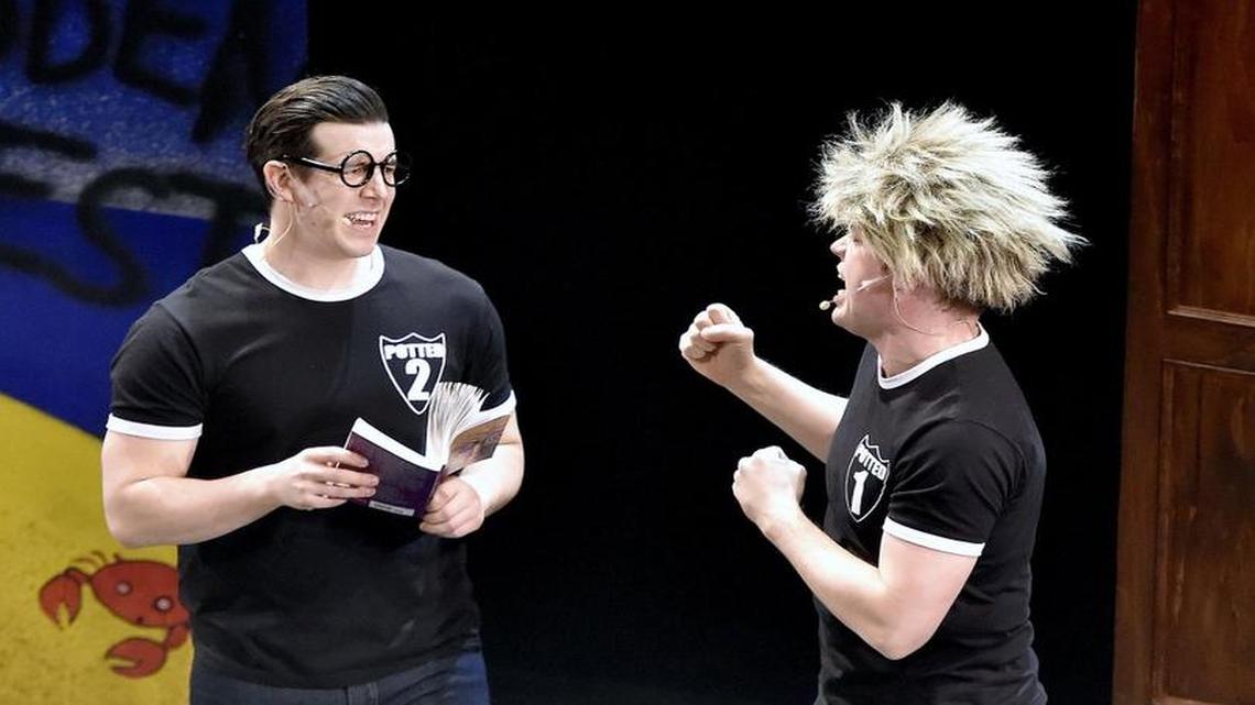 Joseph Maudsley (left) is confronted by James Percy, wearing a wig and proclaiming himself Draco Malfoy in a performance of “Potted Potter” at Starlight Theatre’s indoor stage.