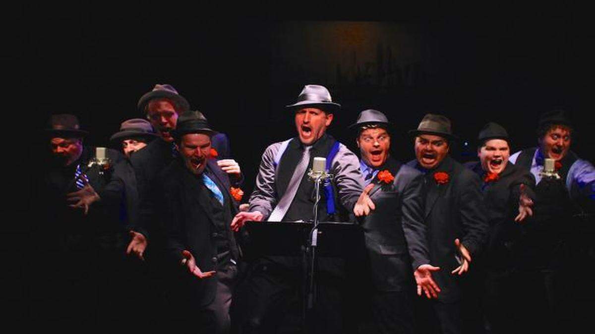 
Christopher Sanders (center) leads the “guys” in “Luck Be a Lady.”
